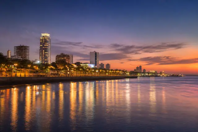 Orla de Assunção no Paraguai ao entardecer — capa do guia de como ligar para o Paraguai